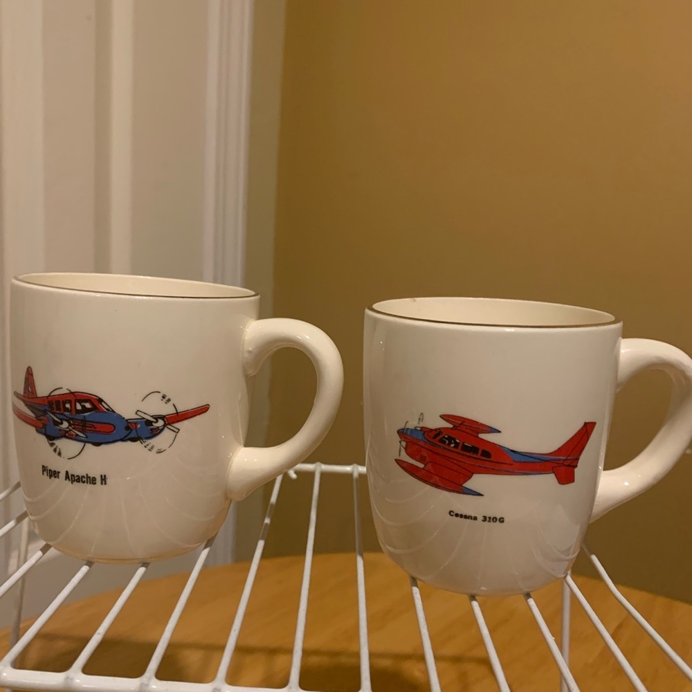 Two Vintage USA Pottery Airplane Coffee Cups